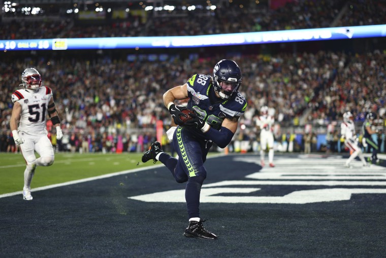 AJ Barner of the Seattle Seahawks catches the ball for a touchdown
